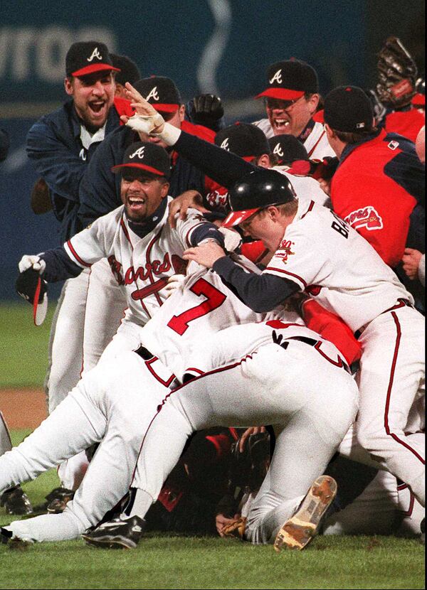 OCTOBER 28, 1995 ATLANTA Atlanta Braves celebrate the end of game 6 against the Cleveland Indians in which they clinched the 1995 World Series in Atlanta before the home crowd at Fulton County Stadium, Saturday, October 28,1995. (AJC photo/Jonathan Newton)