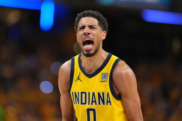 Indiana Pacers guard Tyrese Haliburton reacts after making a three pointer against the Oklahoma City Thunder during the second half of Game 3 of the NBA Finals basketball series, Wednesday, June 11, 2025, in Indianapolis. (AP Photo/Michael Conroy)