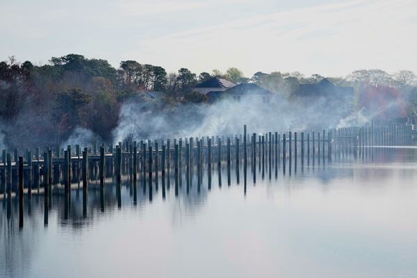 Damage from a wildfire is seen Wednesday, April 23, 2025, in Lacey Township, N.J. (AP Photo/Matt Slocum)