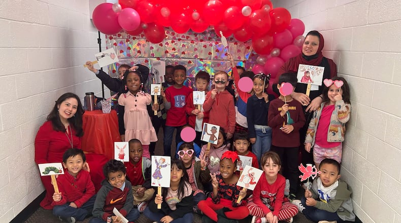 Saadiyah Alani (top right) is a kindergarten assistant as part of a program at the International Community School that helps immigrant women become certified teachers.
