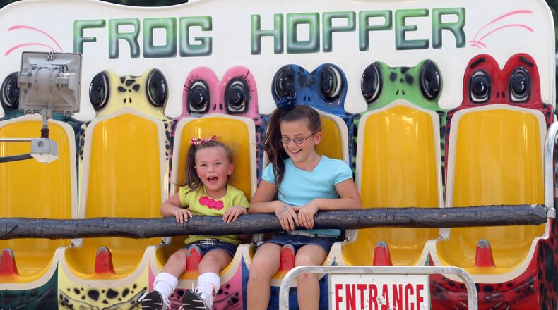 Hope Mattson, 4, rides the "Frog Hopper" with her cousin Savannah Meeler (9) at the Gwinnett County Fair in Lawrenceville in this AJC file phot0.