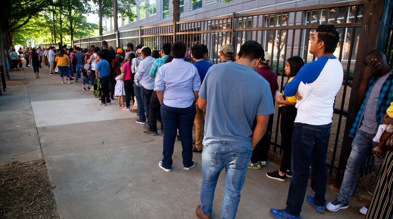 Long lines form outside the Atlanta Immigration Court Tuesday morning, July 2, 2019. STEVE SCHAEFER / SPECIAL TO THE AJC