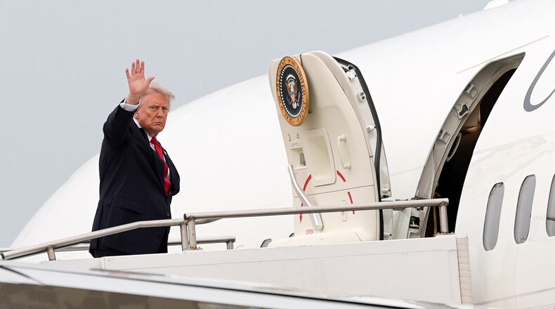 President Donald Trump waves as he departs on Air Force One at Oakland County International Airport, Monday, July 27, 2026, in Waterford Township, Mich. (AP Photo/Alex Brandon)