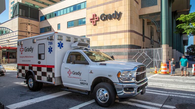 An ambulance leaves Grady Memorial Hospital in Atlanta. Grady’s administration said nurses and other unspecified employees who receive block pay will see a 40% reduction in those rates beginning Sept. 26. (Steve Schaefer/AJC 2022)