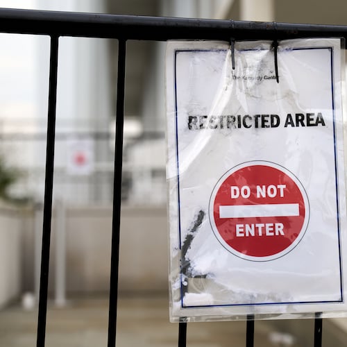 A sign directs people away from behind the Kennedy Center, which has been fenced off and closed to the public, Thursday, Sept. 17, 2026, in Washington. (AP Photo/Jacquelyn Martin)
