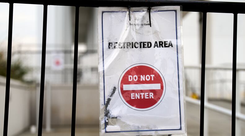 A sign directs people away from behind the Kennedy Center, which has been fenced off and closed to the public, Thursday, Sept. 17, 2026, in Washington. (AP Photo/Jacquelyn Martin)