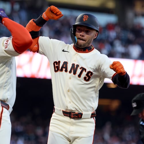 San Francisco Giants' Grant McCray, right, celebrates with Willy Adames (2) after hitting a two-run home run during the fourth inning of a baseball game against the Milwaukee Brewers in San Francisco, Monday, July 27, 2026. (AP Photo/Jed Jacobsohn)
