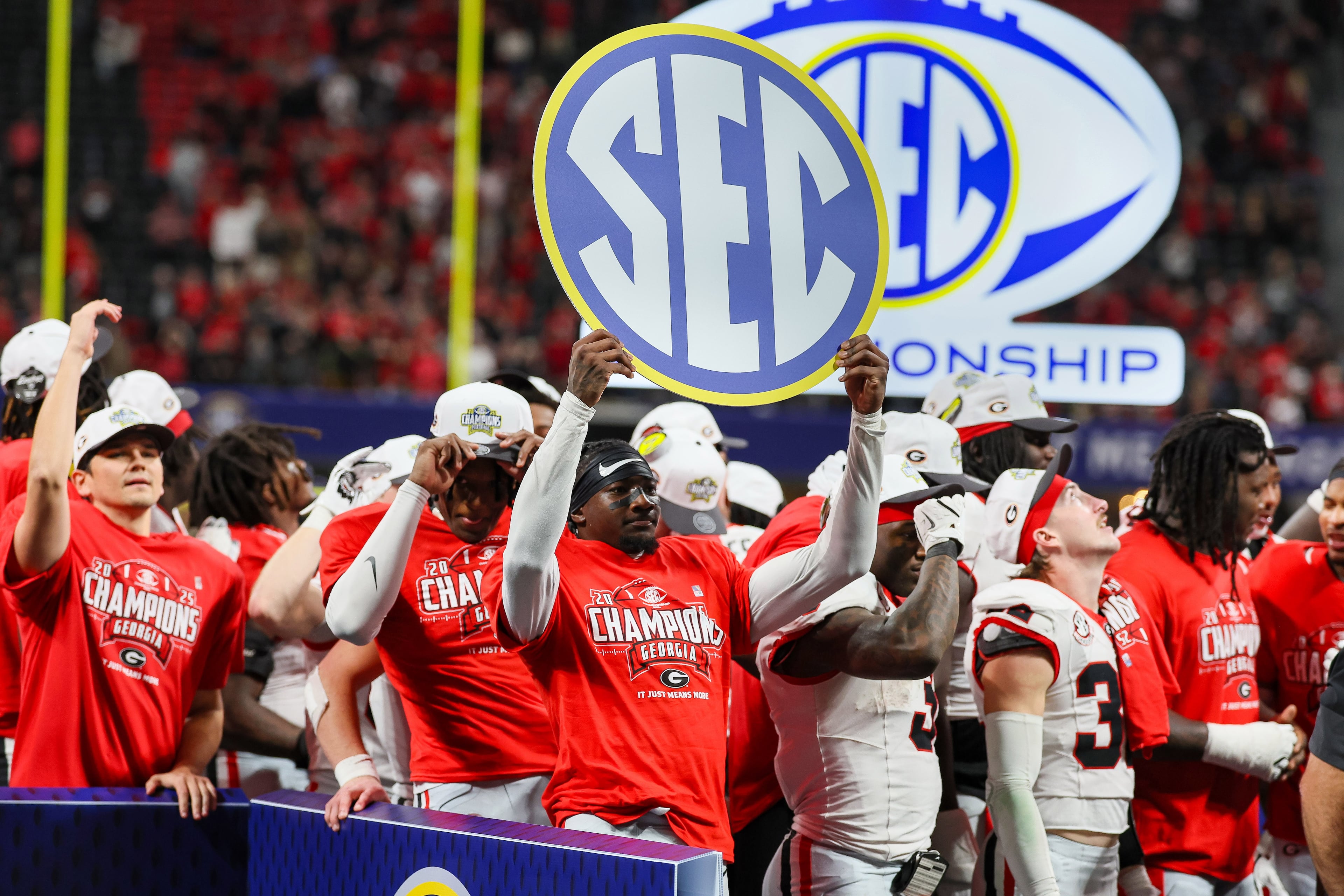 Georgia celebrates a 28-7 victory over Alabama in the SEC Championship game at Mercedes-Benz Stadium, Saturday, Dec. 6, 2025, in Atlanta. (Jason Getz / AJC)