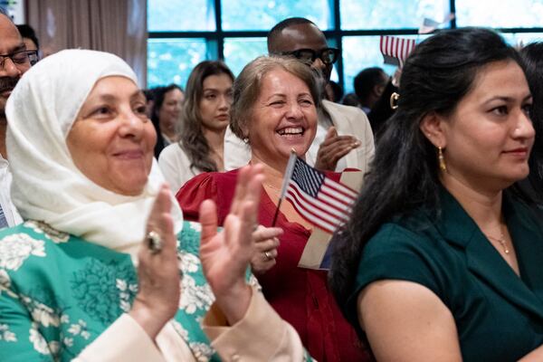 Sefika Dizdarevic, from Bosnia and Herzegovina, can’t hold back her joy as she is sworn in as a naturalized citizen during a ceremony at The Carter Center in Atlanta on Sunday, Oct. 1, 2023. The ceremony was held at the center in honor of President Jimmy Carter’s 99th birthday.   (Ben Gray / Ben@BenGray.com)