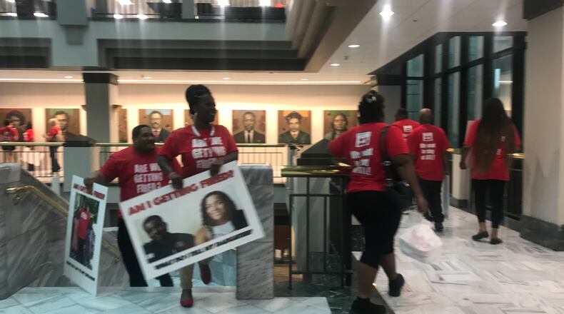 Members of the UNITE HERE union delivered to Atlanta Mayor Kasim Reed's office petition signatures asking for worker retention language in airport concessions contracts.