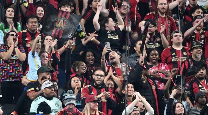 Atlanta United fans cheer during the second half of Atlanta United’s MLS season opener at Mercedes-Benz Stadium, Saturday, February 22, 2025, in Atlanta. Atlanta United won 3-2 over CF Montreal. (Hyosub Shin / AJC)