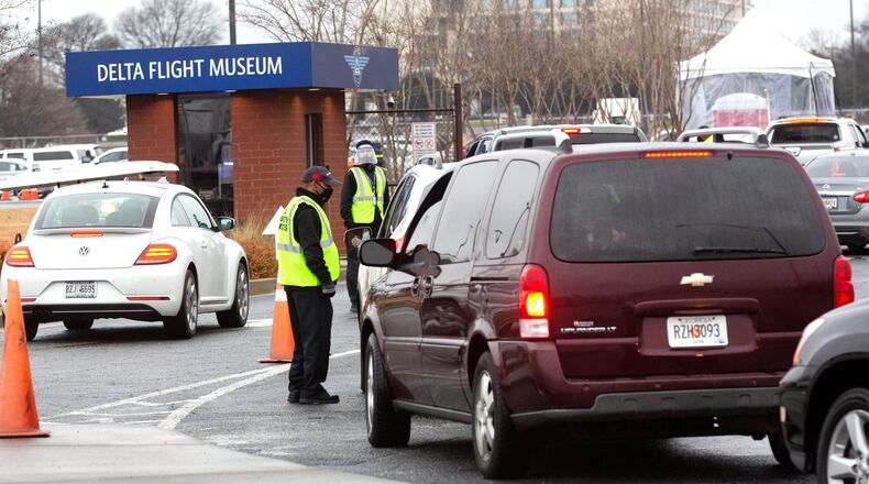 Cars line up at the Delta Air Museum, one of the four mass COVID-19 vaccination sites, Monday morning, February 22, 2021. STEVE SCHAEFER FOR THE ATLANTA JOURNAL-CONSTITUTION
