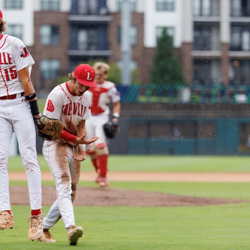 Loganville first basemen Zac Cuneio (15) celebrates after Loganville beat Pope the seventh inning of Game 1 of the GHSA Class 5A Baseball State Championship Series at Gwinnett Field on Monday, May 25, 2026, in Lawrenceville. (Estela Muñoz/AJC)