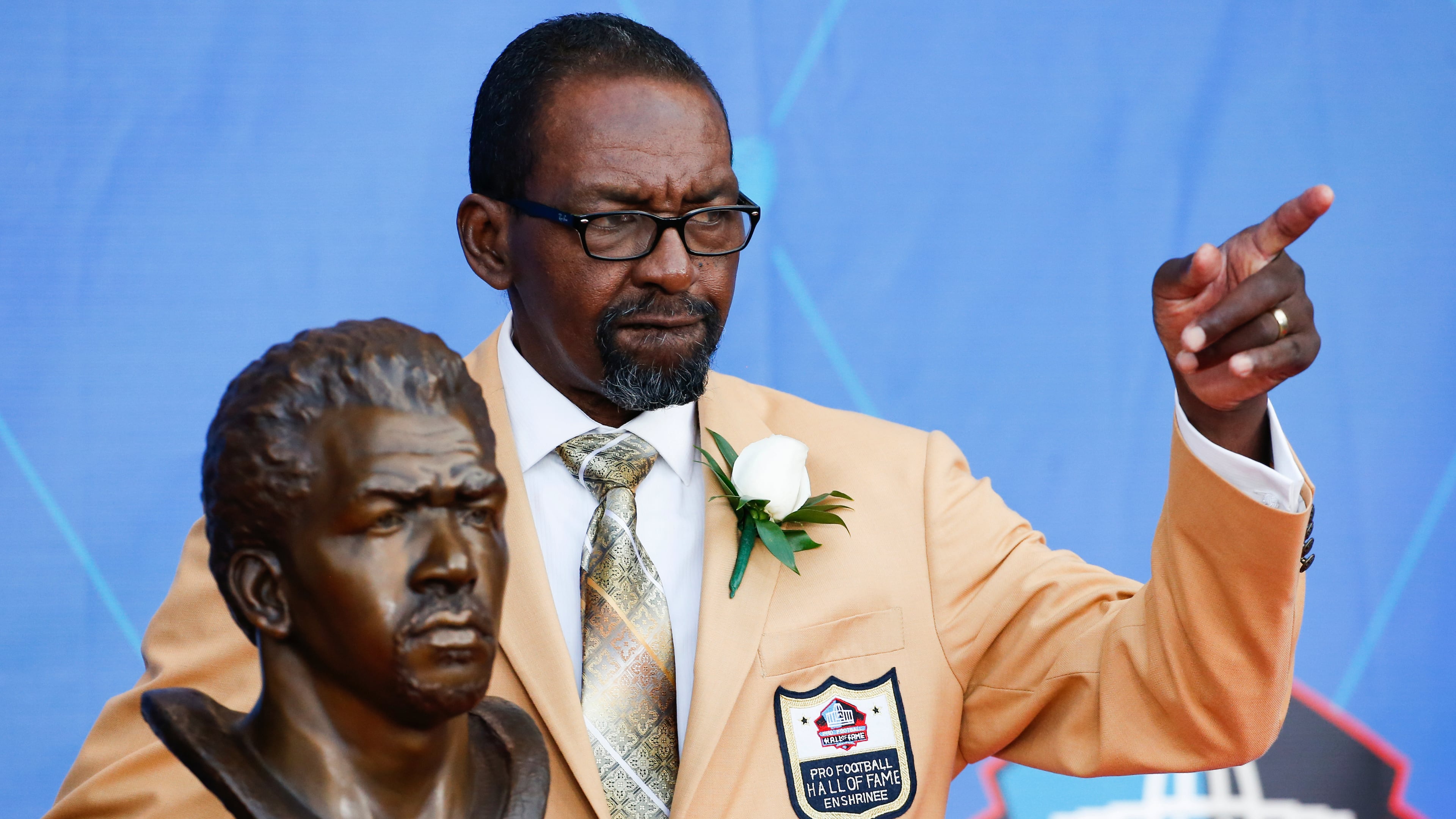 FILE - Former NFL player Kenny Easley poses with a bust of himself during an induction ceremony at the Pro Football Hall of Fame, Saturday, Aug. 5, 2017, in Canton, Ohio. (AP Photo/Ron Schwane, File)