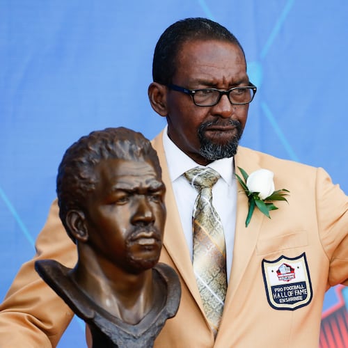 FILE - Former NFL player Kenny Easley poses with a bust of himself during an induction ceremony at the Pro Football Hall of Fame, Saturday, Aug. 5, 2017, in Canton, Ohio. (AP Photo/Ron Schwane, File)