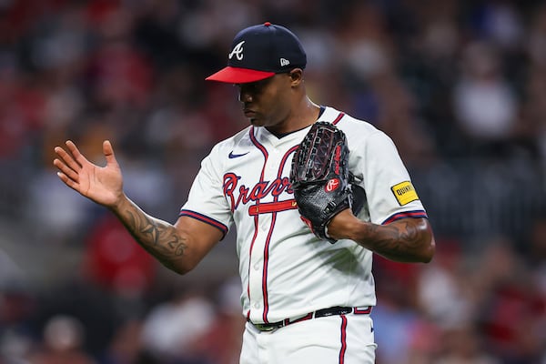 Atlanta Braves pitcher Raisel Iglesias reacts after the eighth inning of a baseball game against the Los Angeles Angels, Thursday, July 3, 2025, in Atlanta. (AP Photo/Colin Hubbard)