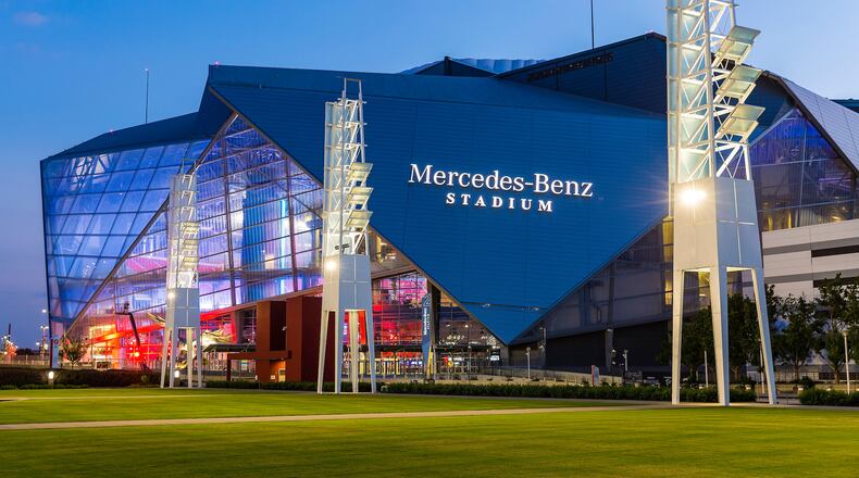 A general view of the exterior of Mercedes-Benz Stadium, as seen from the International Plaza, after sunset, Thursday, August 24, 2017 in Atlanta. (Paul Abell via Abell Images for Chick-fil-A Peach Bowl)
