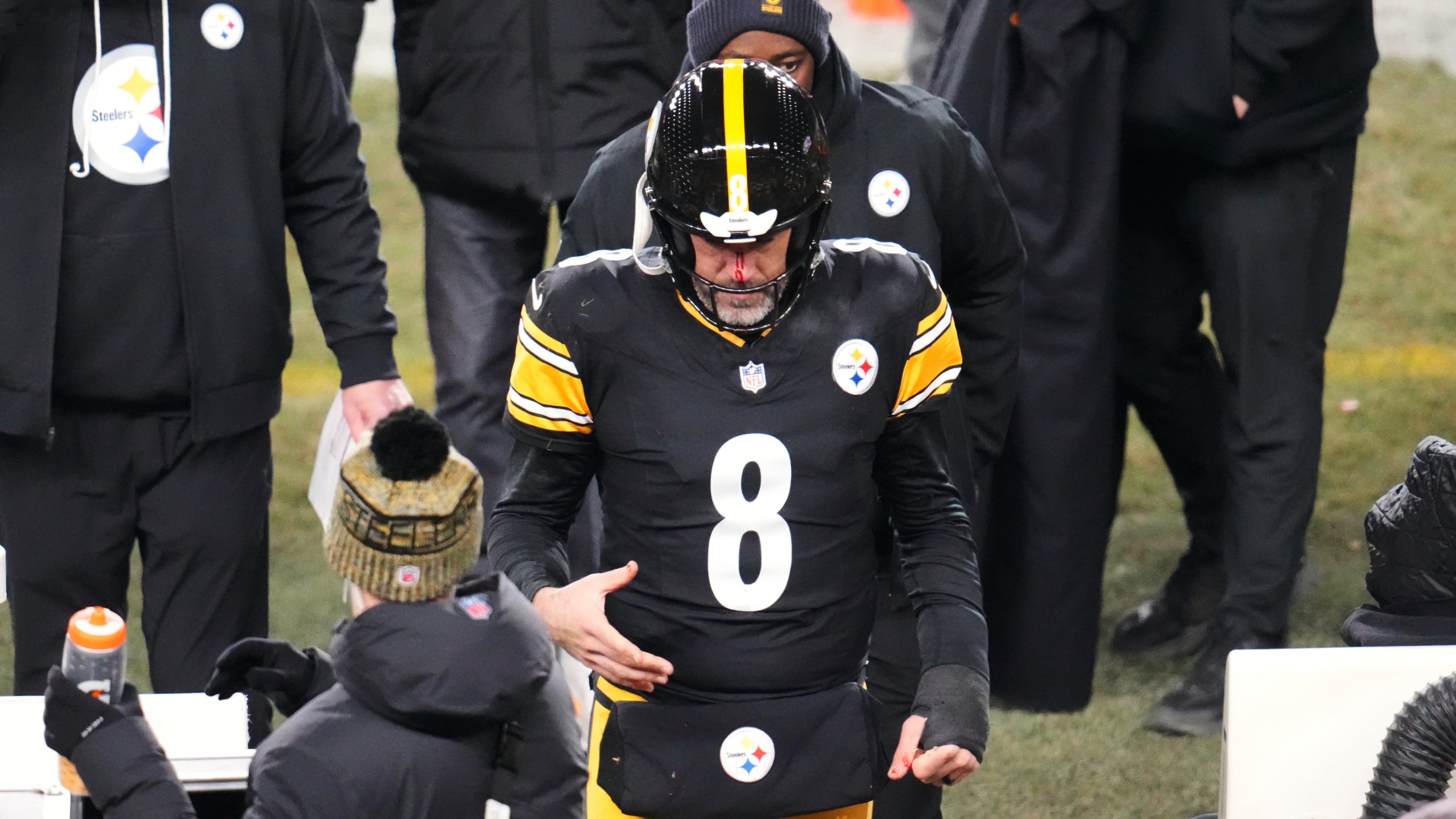 Pittsburgh Steelers quarterback Aaron Rodgers (8) walks to the sideline to be check out for injury during the second half of an NFL football game against the Buffalo Bills Sunday, Nov. 30, 2025, in Pittsburgh. (AP Photo/Gene J. Puskar)