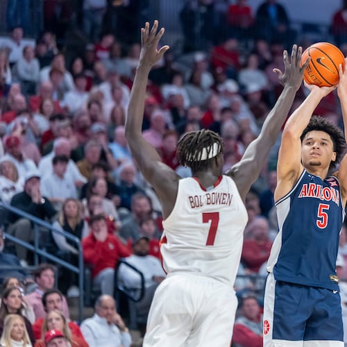 Alabama forward Amari Allen (5) shoots and hits a three-point shot over the defense of Alabama forward Taylor Bol Bowen (7) during the second half of an NCAA college basketball game, Saturday, Dec. 13, 2025, in Birmingham, Ala. (AP Photo/Vasha Hunt)