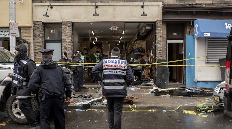 A gunfight at a kosher market on Dec. 10 left several people dead in Jersey City, N.J. Among those killed were the two armed suspects who stormed the market; they had expressed interest in the Black Hebrew Israelites, a fringe religious group whose members often rail against Jews and whites. BRYAN ANSELM / THE NEW YORK TIMES