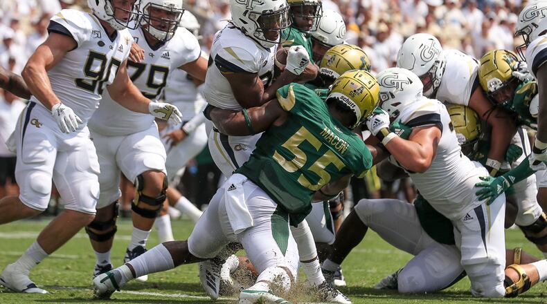 Georgia Tech Yellow Jackets running back Jordan Mason (27) runs the ball for a touchdown against the South Florida Bull. (Alyssa Pointer/alyssa.pointer@ajc.com)