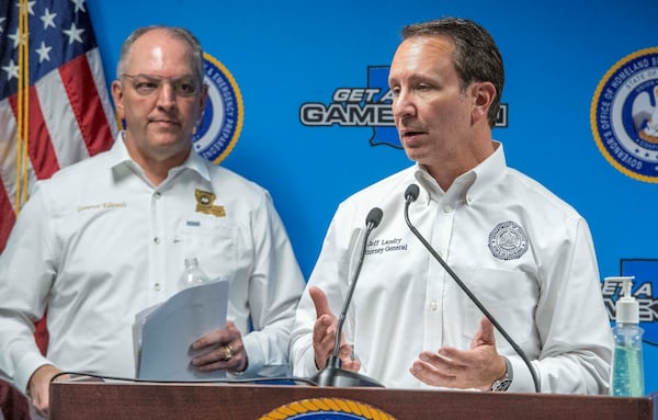 FILE - Louisiana Gov. John Bel Edwards, left, listens as Attorney General Jeff Landry, right, speaks during a news conference at the Governor's Office of Homeland Security & Emergency Management, April 6, 2020, in Baton Rouge, La. (Bill Feig/The Advocate via AP, Pool, File)