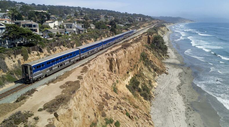 A Surfliner train by Amtrak travels along the collapsing bluffs in Del Mar, California. (John Gibbins/The San Diego Union-Tribune/TNS)