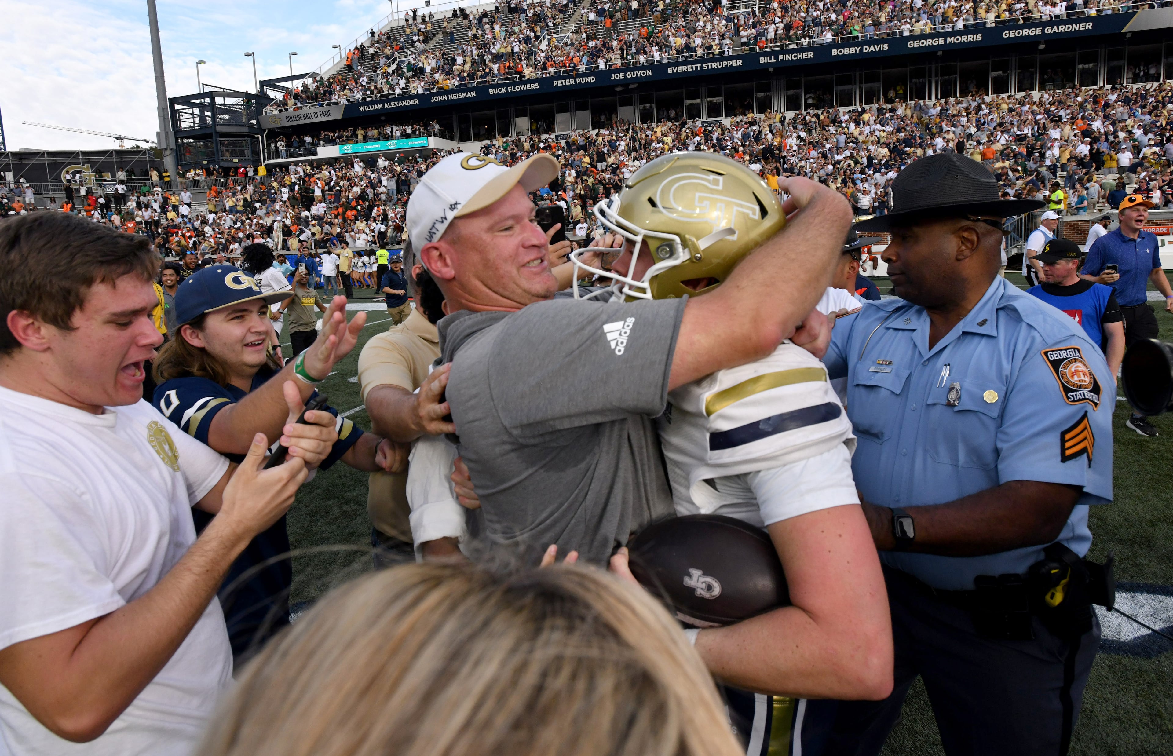Tech head coach Brent Key and quarterback Haynes King celebrate after defeating Miami 28-23 at Bobby Dodd Stadium on Saturday, Nov. 9, 2024, in Atlanta. (Hyosub Shin/AJC)