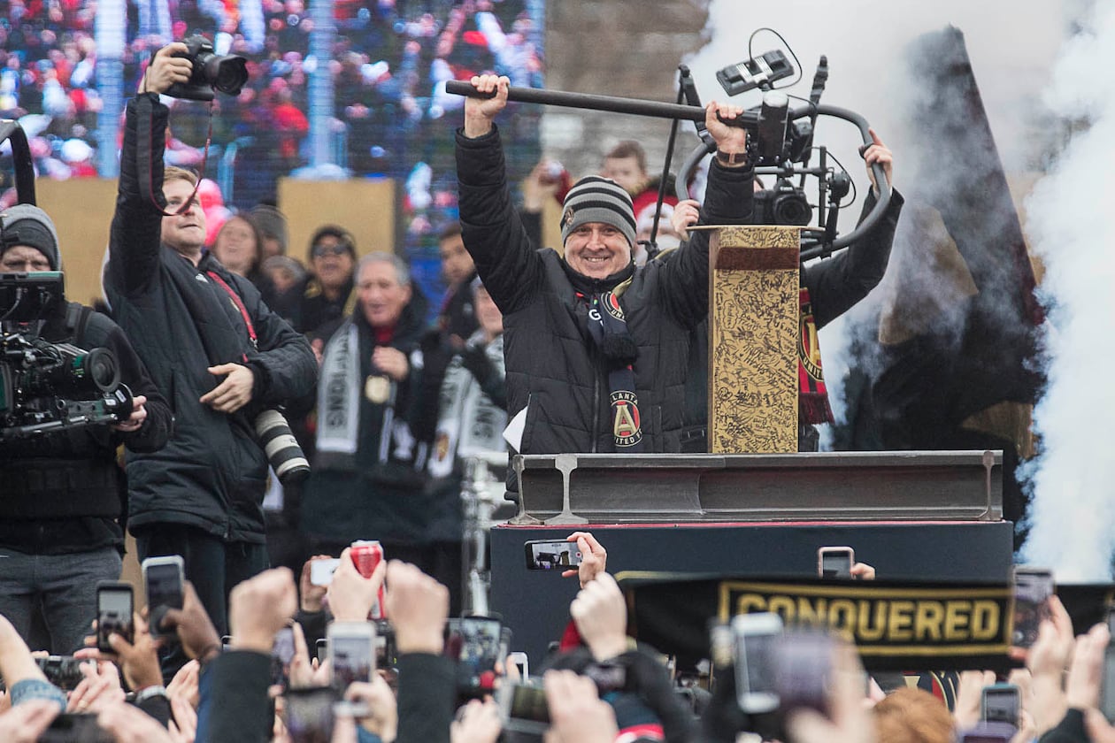 Atlanta United outgoing manager Gerardo "Tata" Martino is applauded after hammering the Golden Spike during the MLS championship rally Monday, Dec. 10, 2018, at Mercedes-Benz Stadium in Atlanta. (Alyssa Pointer/AJC)