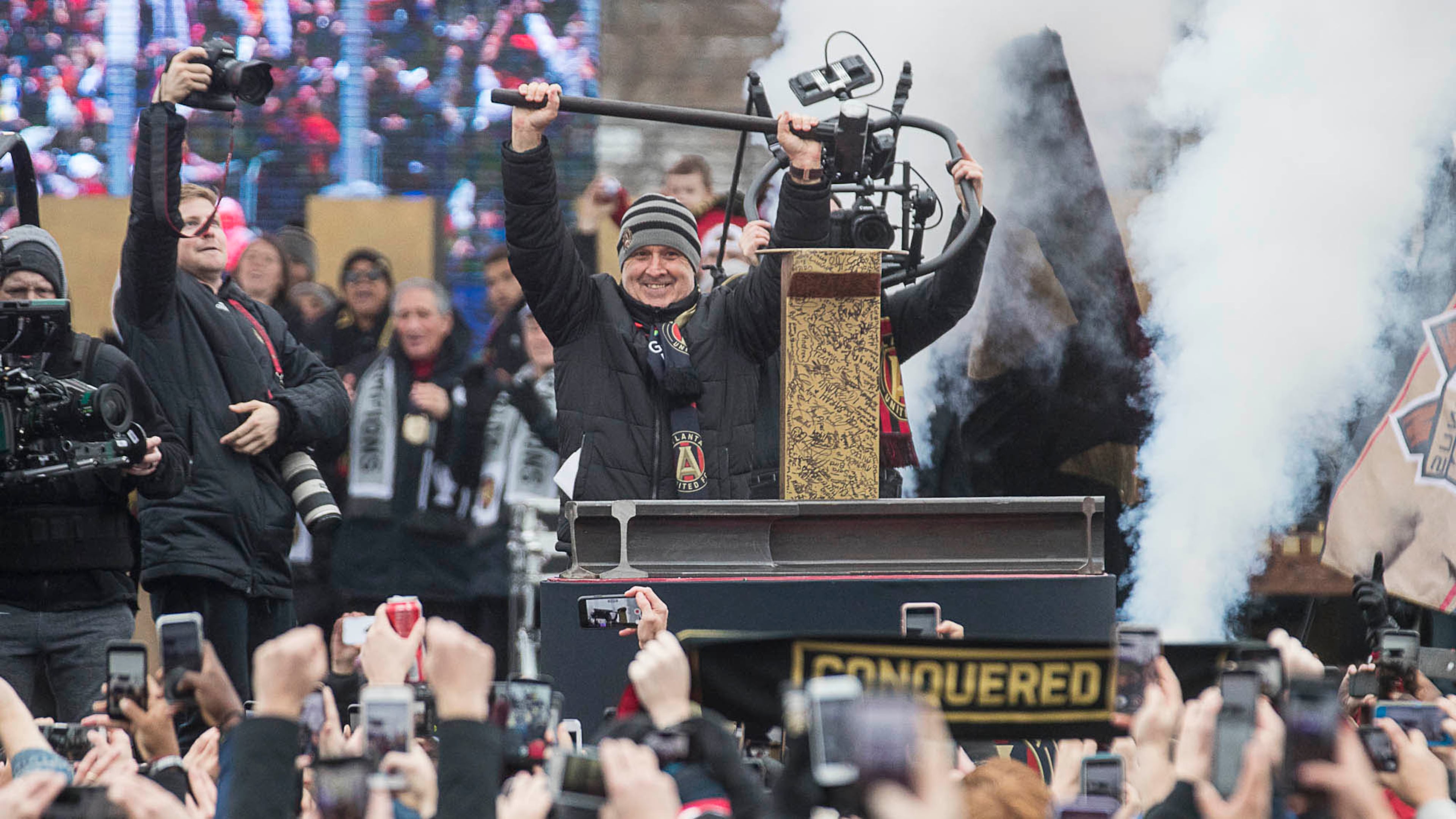 Atlanta United outgoing manager Gerardo "Tata" Martino is applauded after hammering the Golden Spike during the MLS championship rally Monday, Dec. 10, 2018, at Mercedes-Benz Stadium in Atlanta. (Alyssa Pointer/AJC)