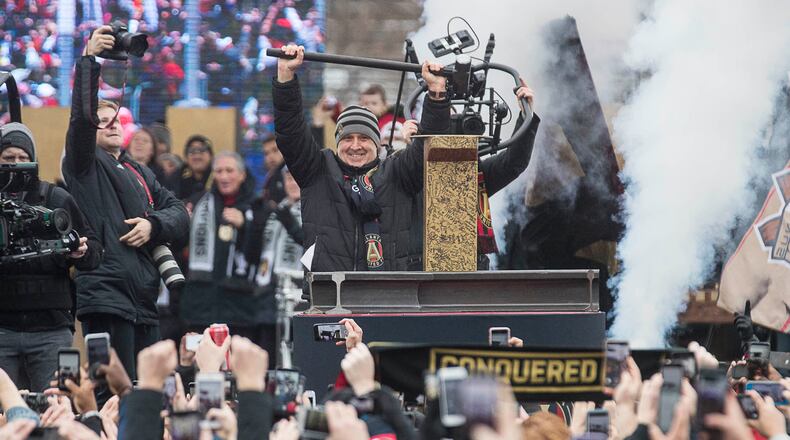 Atlanta United outgoing manager Gerardo "Tata" Martino is applauded after hammering the Golden Spike during the MLS championship rally Monday, Dec. 10, 2018, at Mercedes-Benz Stadium in Atlanta.