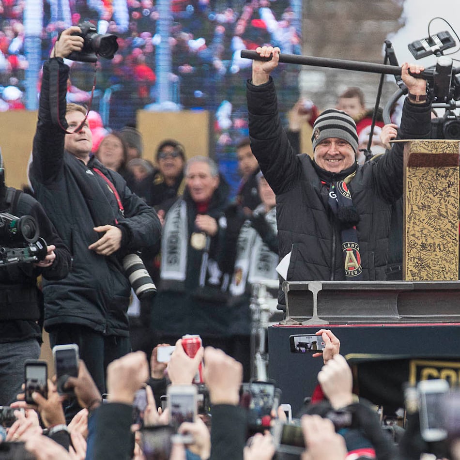 Atlanta United outgoing manager Gerardo "Tata" Martino is applauded after hammering the Golden Spike during the MLS championship rally Monday, Dec. 10, 2018, at Mercedes-Benz Stadium in Atlanta. (Alyssa Pointer/AJC)