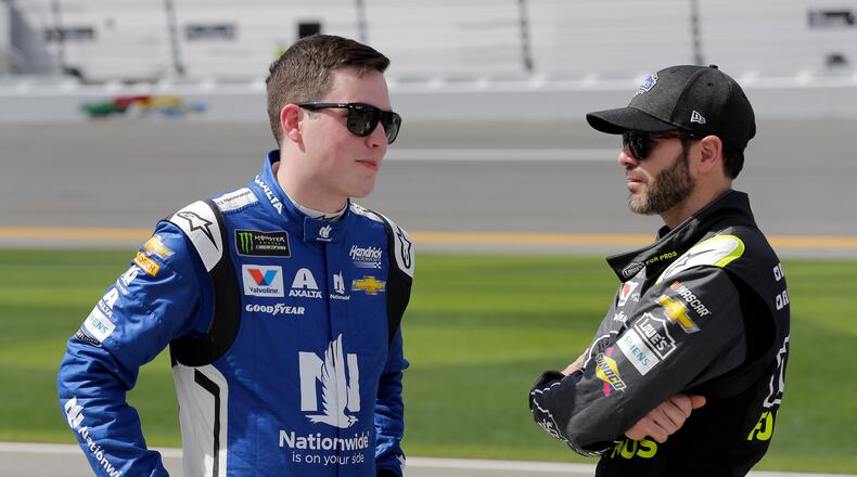 Who is that old guy to the right of Daytona 500 pole-sitter AIex Bowman? Oh, it's seven-time series champion Jimmie Johnson. (AP Photo/Terry Renna)