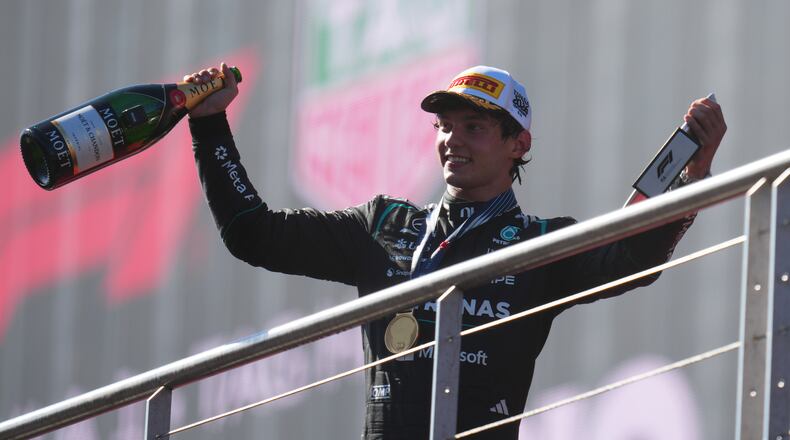 Mercedes driver Andrea Kimi Antonelli of Italy celebrates on the podium after winning the Spanish Formula One Grand Prix race in Madrid, Sunday, Sept. 13, 2026. (AP Photo/Manu Fernandez)