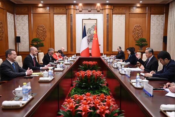 French Foreign Minister Jean-Noel Barrot, second left, meets China's Foreign Minister Wang Yi, second right, at the Diaoyutai State Guesthouse in Beijing Thursday, March 27, 2025. (Greg Baker/Pool Photo via AP)