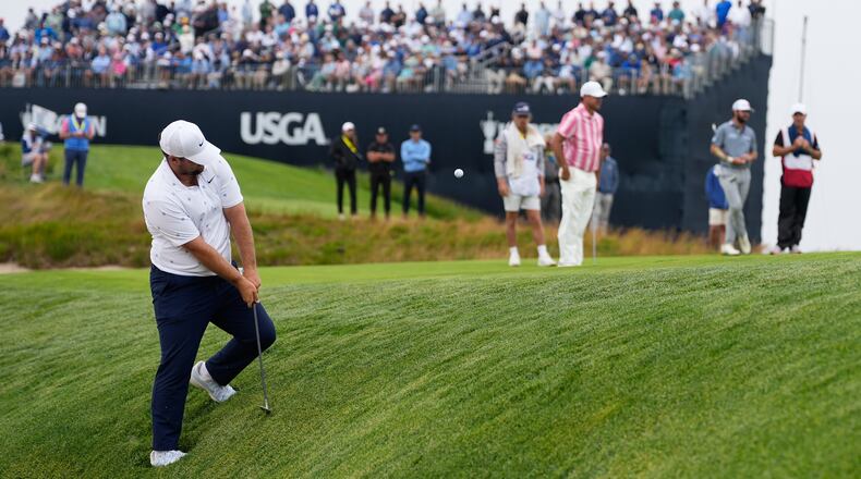 Chris Gotterup chips to the green on the 11th hole during the first round of the U.S. Open golf tournament at Shinnecock Hills Golf Club in Southampton, N.Y., Thursday, June 18, 2026.(AP Photo/George Walker IV)