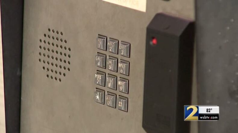 A woman said she was robbed at gunpoint by a man pretending to be a resident of her apartment complex. (Credit: Channel 2 Action News)