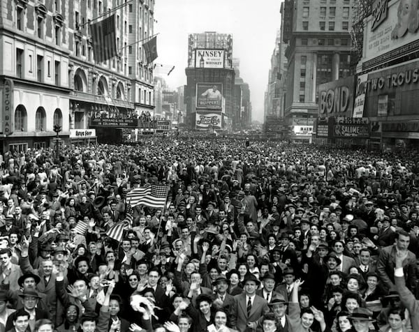 FILE - Looking north from 44th Street, New York's Times Square is packed Monday, May 7, 1945, with crowds celebrating the news of Germany's unconditional surrender in World War II. (AP Photo/Tom Fitzsimmons, File)
