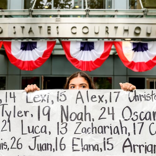 Olivia Konar holds a banner with names of young people who advocates say died as a result of social media outside the Ronald V. Dellums Federal Building and U.S. Courthouse on Tuesday, Aug. 18, 2026, in Oakland, Calif. Her sister Coco Konar died in 2022 when she was 17. (AP Photo/Noah Berger)