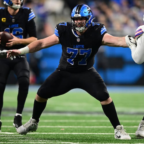 FILE - Detroit Lions center Frank Ragnow looks to block during the second half of an NFL football game against the Buffalo Bills in Detroit, Dec. 15, 2024. (AP Photo/David Dermer, File)
