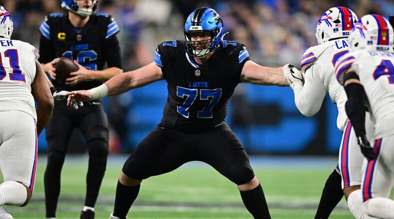 FILE - Detroit Lions center Frank Ragnow looks to block during the second half of an NFL football game against the Buffalo Bills in Detroit, Dec. 15, 2024. (AP Photo/David Dermer, File)