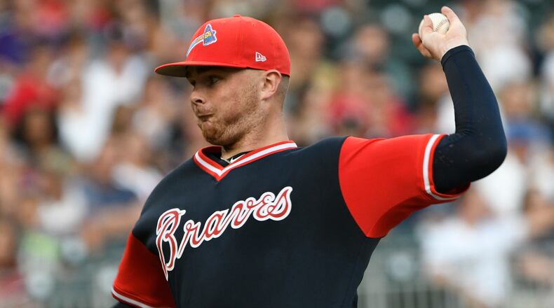 Atlanta Braves' Sean Newcomb pitches during the first inning of a baseball game against the Colorado Rockies, Saturday, Aug. 26, 2017, in Atlanta. (AP Photo/John Amis)