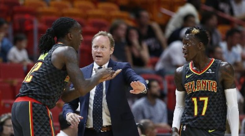 Taurean Prince (left), Dennis Schroder and coach Mike Budenholzer' are key factors for Hawks this season. (AP Photo)