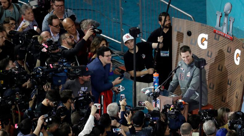 New England Patriots' Tom Brady answers questions during opening night for the NFL Super Bowl 51 football game at Minute Maid Park Monday, Jan. 30, 2017, in Houston. (AP Photo/Eric Gay)