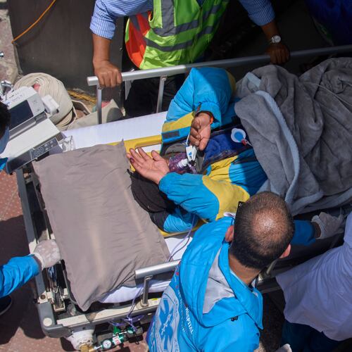 Medics take Dawa Sherpa, a mountain guide who had been missing for several days in the Everest region, for treatment after he arrived at HAMS Hospital in Kathmandu, Nepal, Thursday, June 4, 2026. (AP Photo/Niranjan Shrestha) CORRECTION: Corrects hospital name to HAMS not Grande