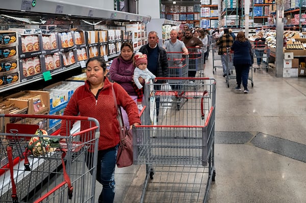 FILE - Customers wait in line for eggs at a Costco store in the Van Nuys section of Los Angeles on Wednesday, Feb. 19, 2025. (AP Photo/Richard Vogel, File)