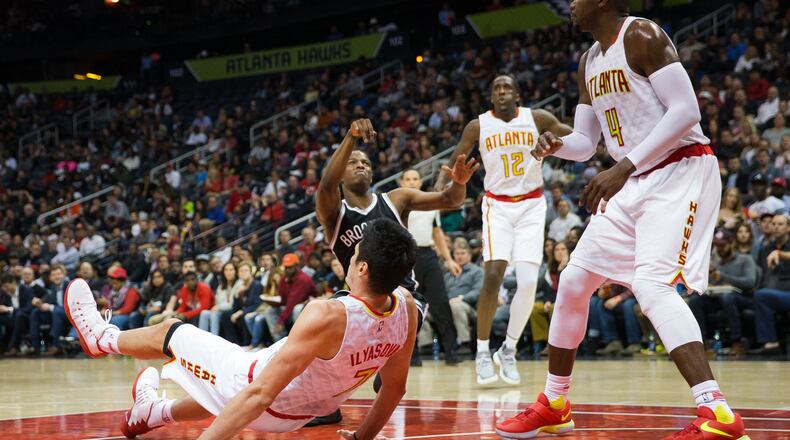 The Atlanta Hawks’ Ersan Ilyasova successfully draws a charge from the Brooklyn Nets’ Isaiah Whitehead during a home game at the Philips Arena in Atlanta on March 8, 2017. (Kevin D. Liles/The New York Times)