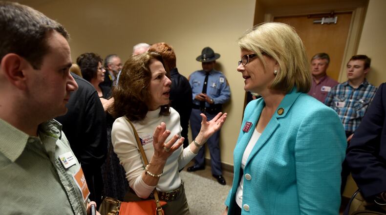 State Rep.Beth Beskin, R-Atlanta, (right) listens in the aftermath of a 2015 hearing at the state Capitol. AJC file