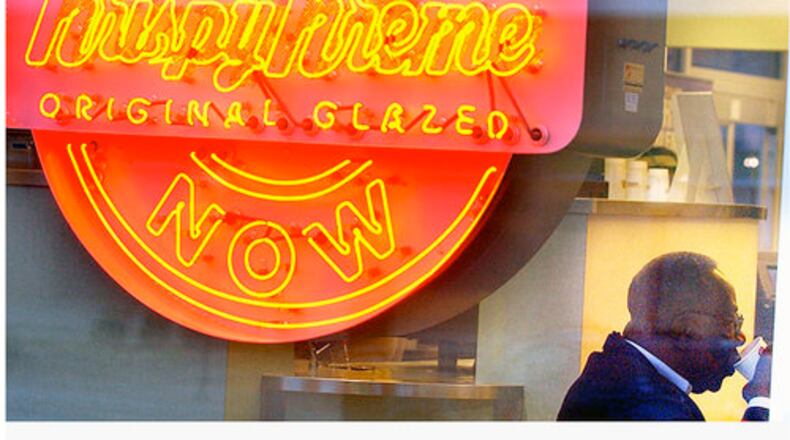When Hank Aaron dived into the business world, he encountered plenty of skeptics. "I remember that and I said, 'If I have to crawl at night, I won't fail. I'm going to make all these people eat their words.' I'll do anything not to fail and that's why I kept pushing." Here, he's shown at a Krispy Kreme owned by his restaurant company. (Joey Ivansco / AJC 2004)
