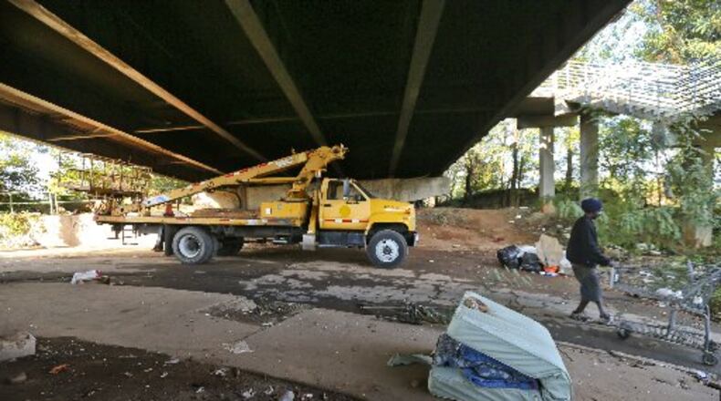 A scene under the Martin Luther King Jr. Drive bridge in October 2012 following a fire that damaged the structure. JOHN SPINK / AJC